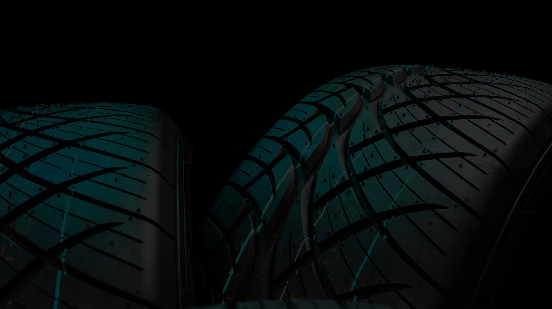 Tires and custom wheels inside a Local Tire & Wheel showroom